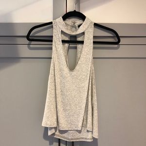 Gray high neck tank top with opening.